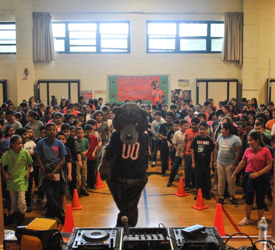 Staley da Bear dances with students