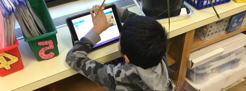 A second grade student celebrate Hour of Code with a Star Wards coding game.