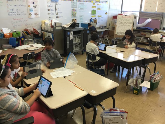 Second graders practice their coding skills in Mrs. Gomez's classroom.
