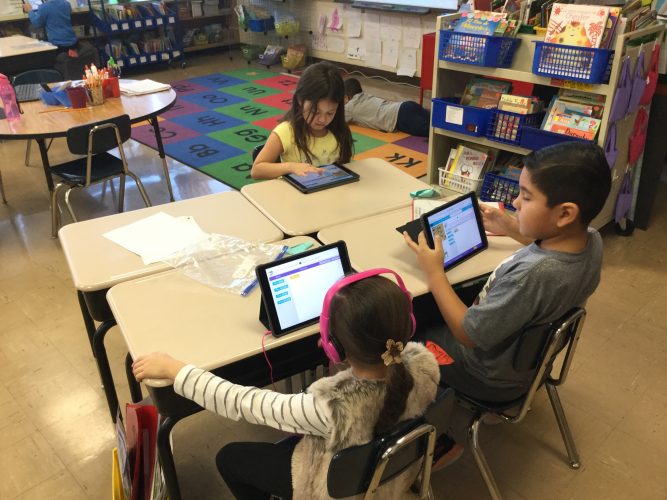 Second graders practice their coding skills in Mrs. Gomez's classroom.