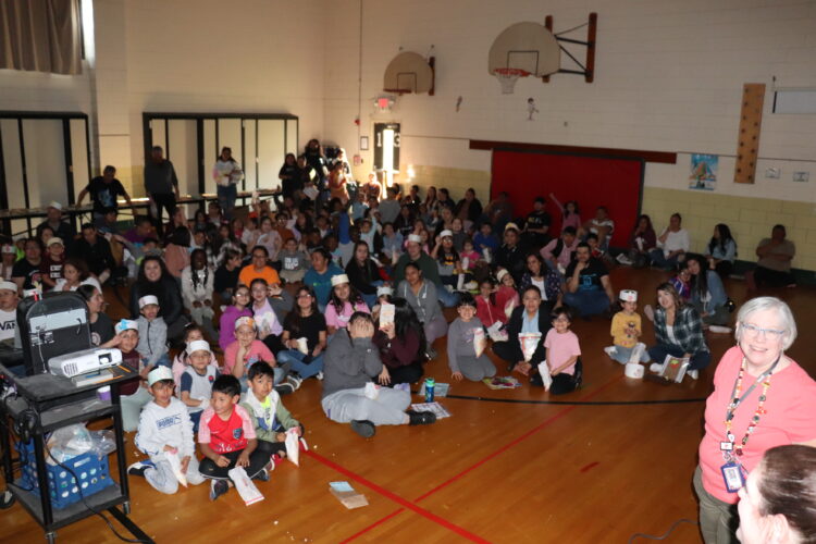 Families and students gathered at the end to watch "Hair Love".
