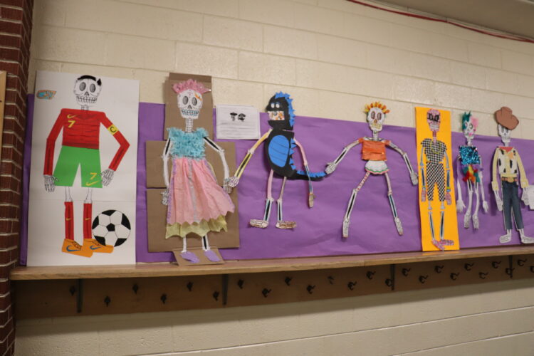 Ist Grade family projects in the main hallway of Hermes.