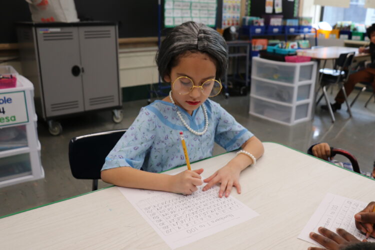 A "very old" first grader works on counting to 100.