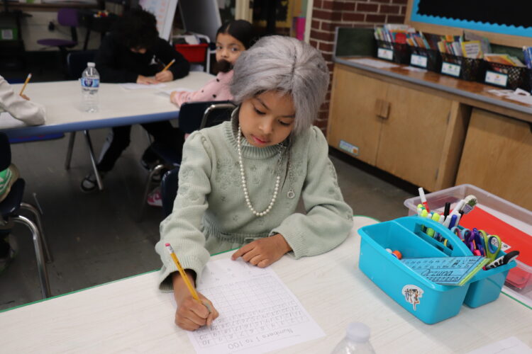 A "very old" first grader works on counting to 100.