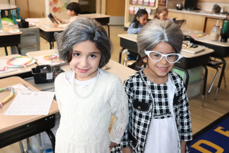 A few "older ladies" in Kindergarten pose for the camera.