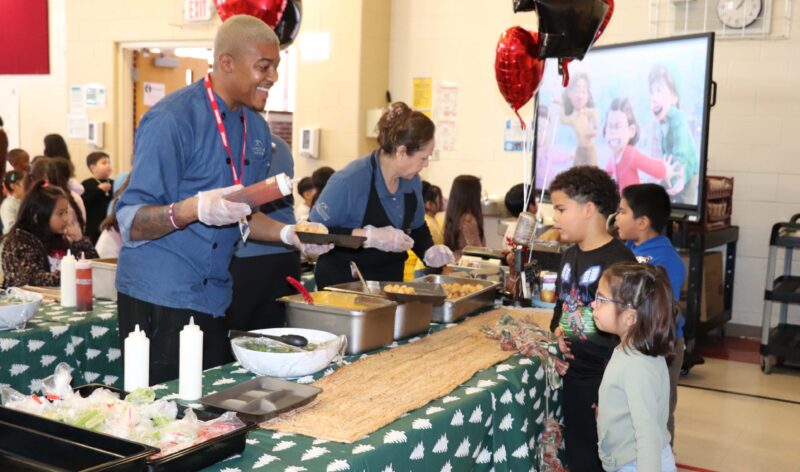 Chef Cam and Whitson's staff serve Kindergarteners and 1st graders during their lunch period.