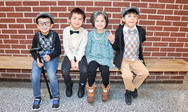 Kindergarten students show off their 100th day outfits.